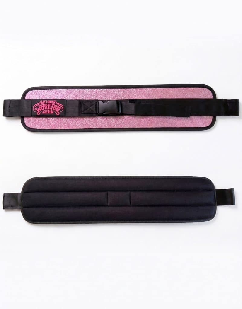 Front and back view of the Warrior Gear pink glitter hip thrust belt showing the fastening strap and black padding.